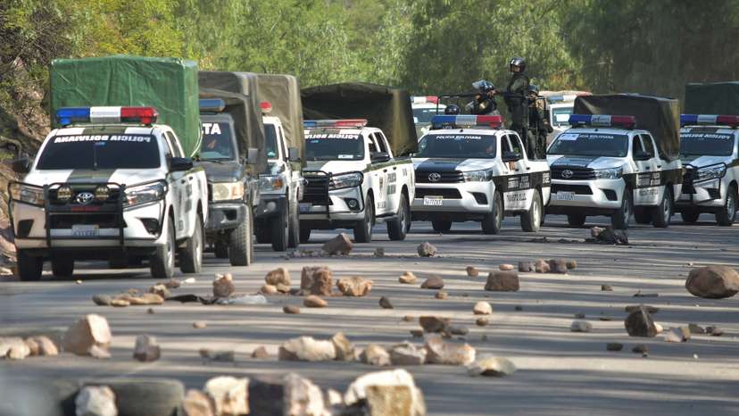 Police attempt to dismantle blockade set by supporters of Bolivia’s former President Morales, outside of Cochabamba