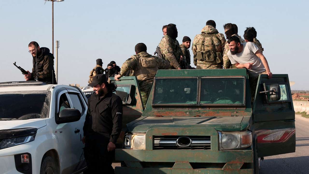 FILE PHOTO: Syrian army personnel gather as they head towards Latakia to join the fight against the fighters linked to Syria's ousted leader Bashar al-Assad, in Aleppo