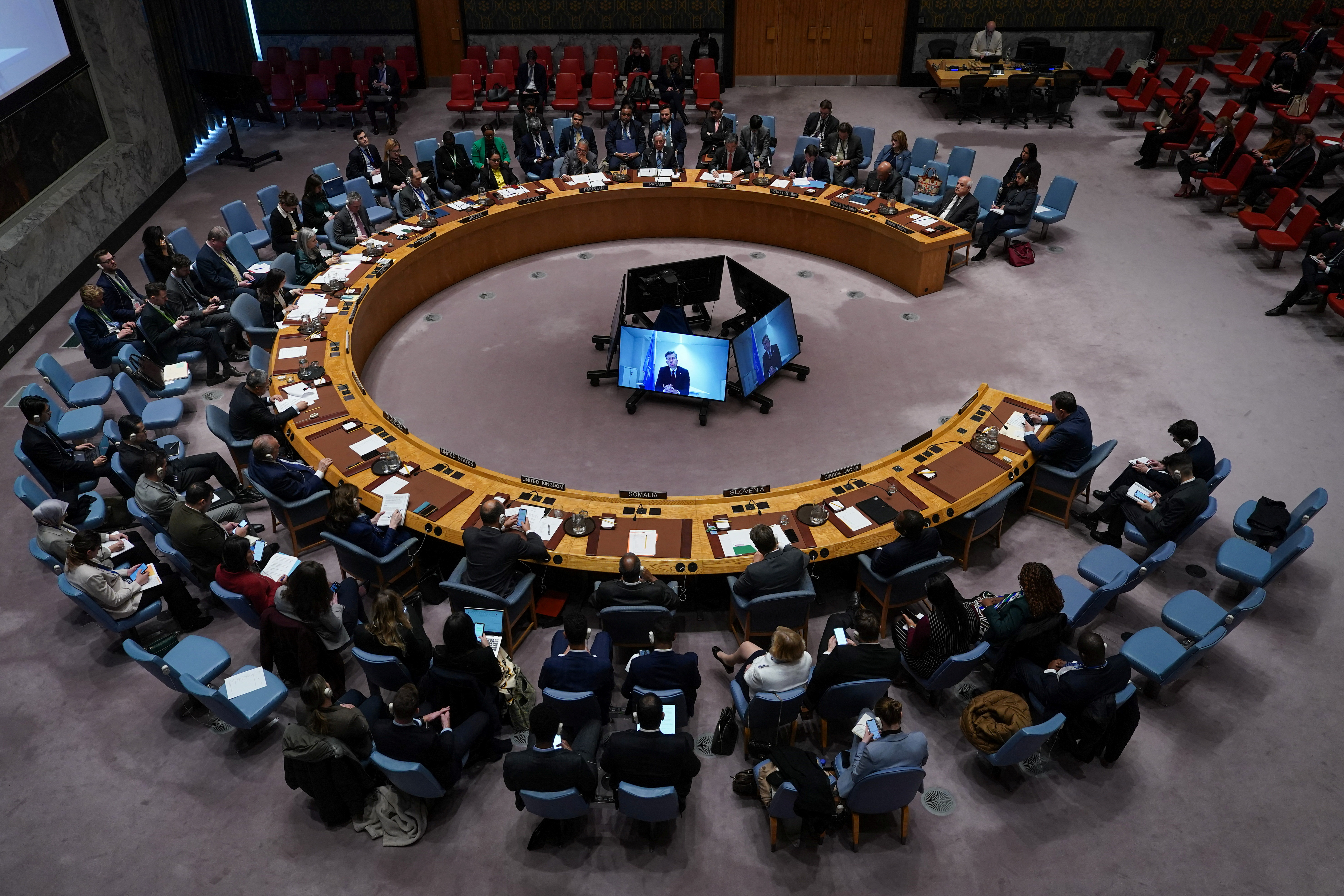 People attend a Security Council meeting at the United Nations headquarters in New York City