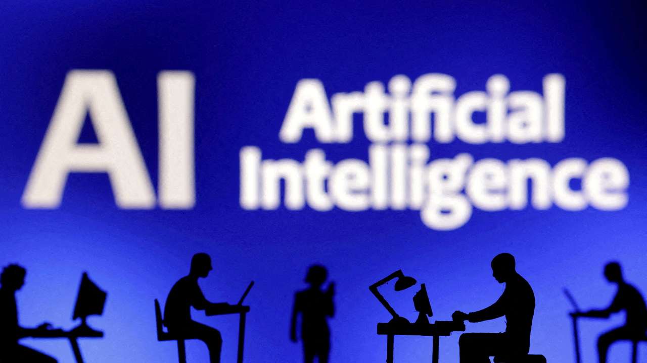 FILE PHOTO: Figurines with computers and smartphones are seen in front of the words "Artificial Intelligence AI" in this illustration taken, February 19, 2024. REUTERS/Dado Ruvic/Illustration/File Photo
