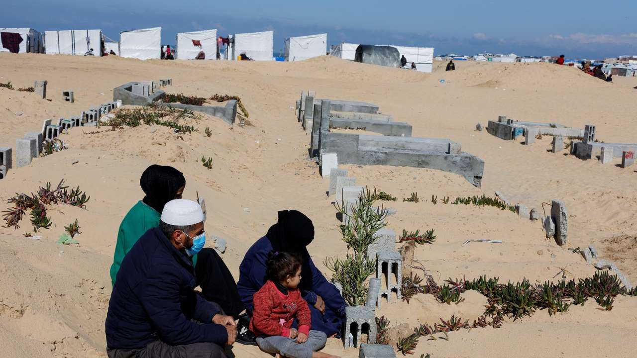 Displaced Palestinians shelter in a cemetery in Rafah in the southern Gaza Strip