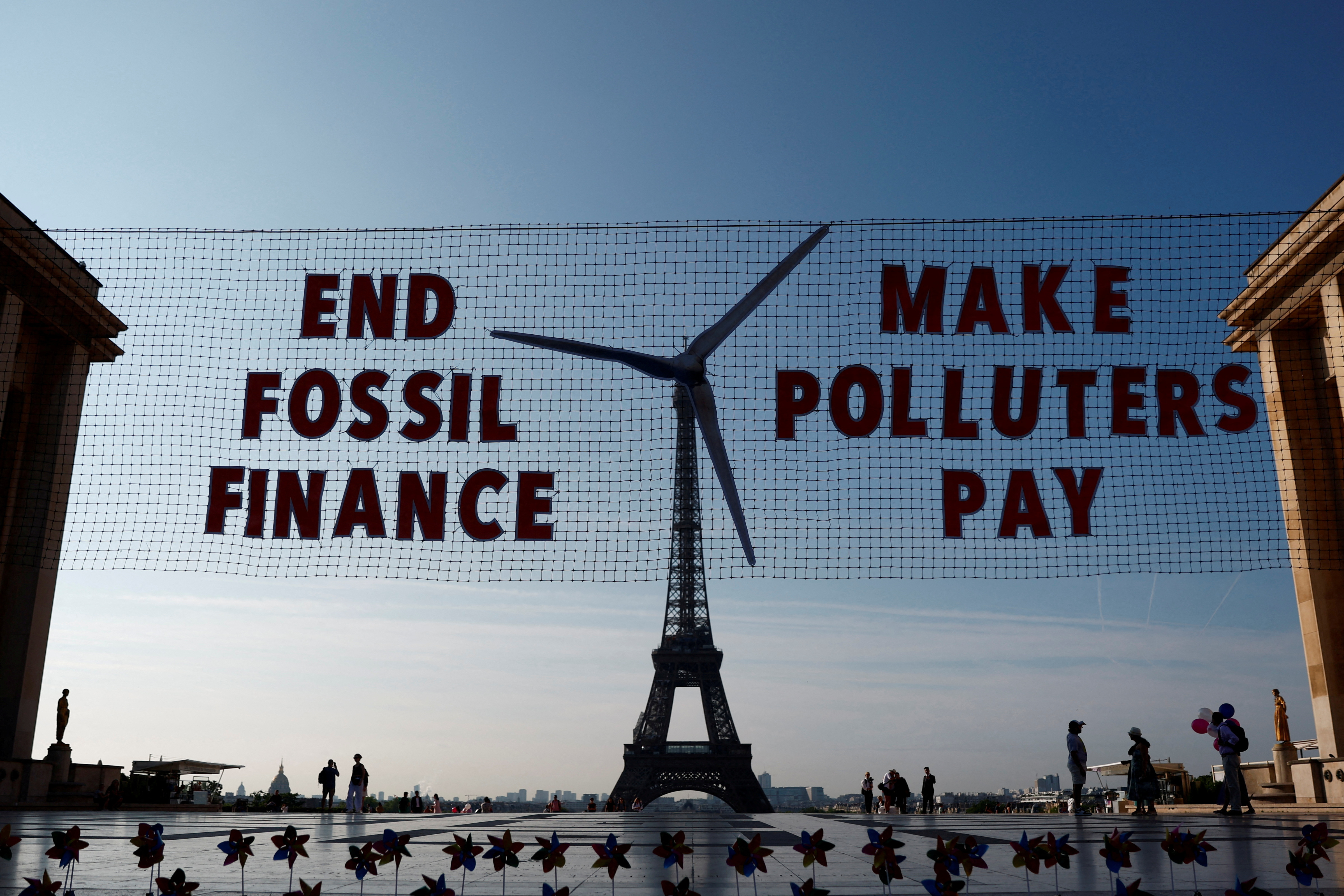 FILE PHOTO: Activists turn Eiffel Tower into giant wind turbine to welcome world leaders in Paris