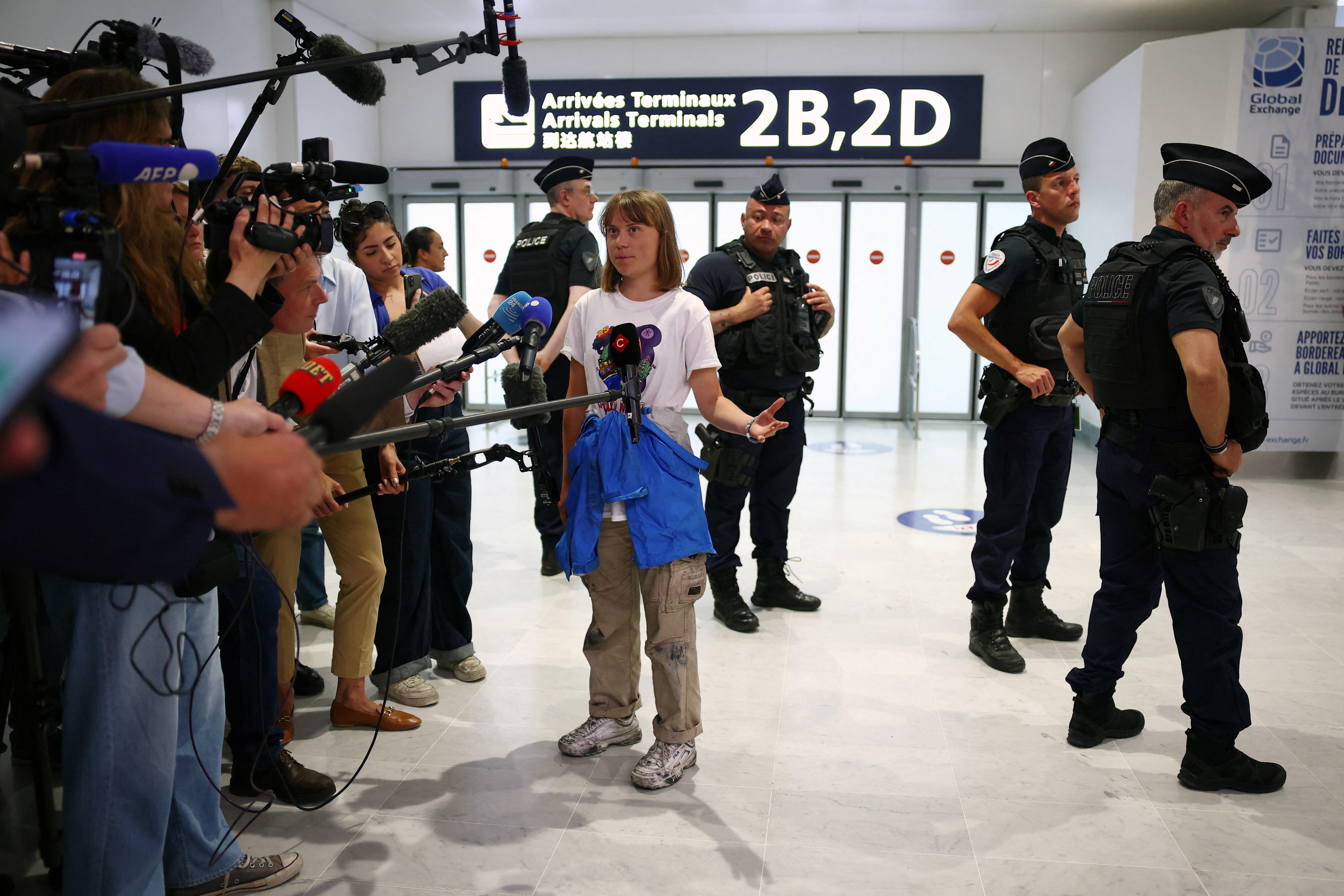 Swedish activist Greta Thunberg arrives at Paris airport
