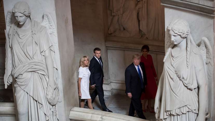 French President Emmanuel Macron and his wife Brigitte tour Napoleon's Tomb with US President Donald Trump and First Lady Melania Trump at Les Invalides museum in Paris