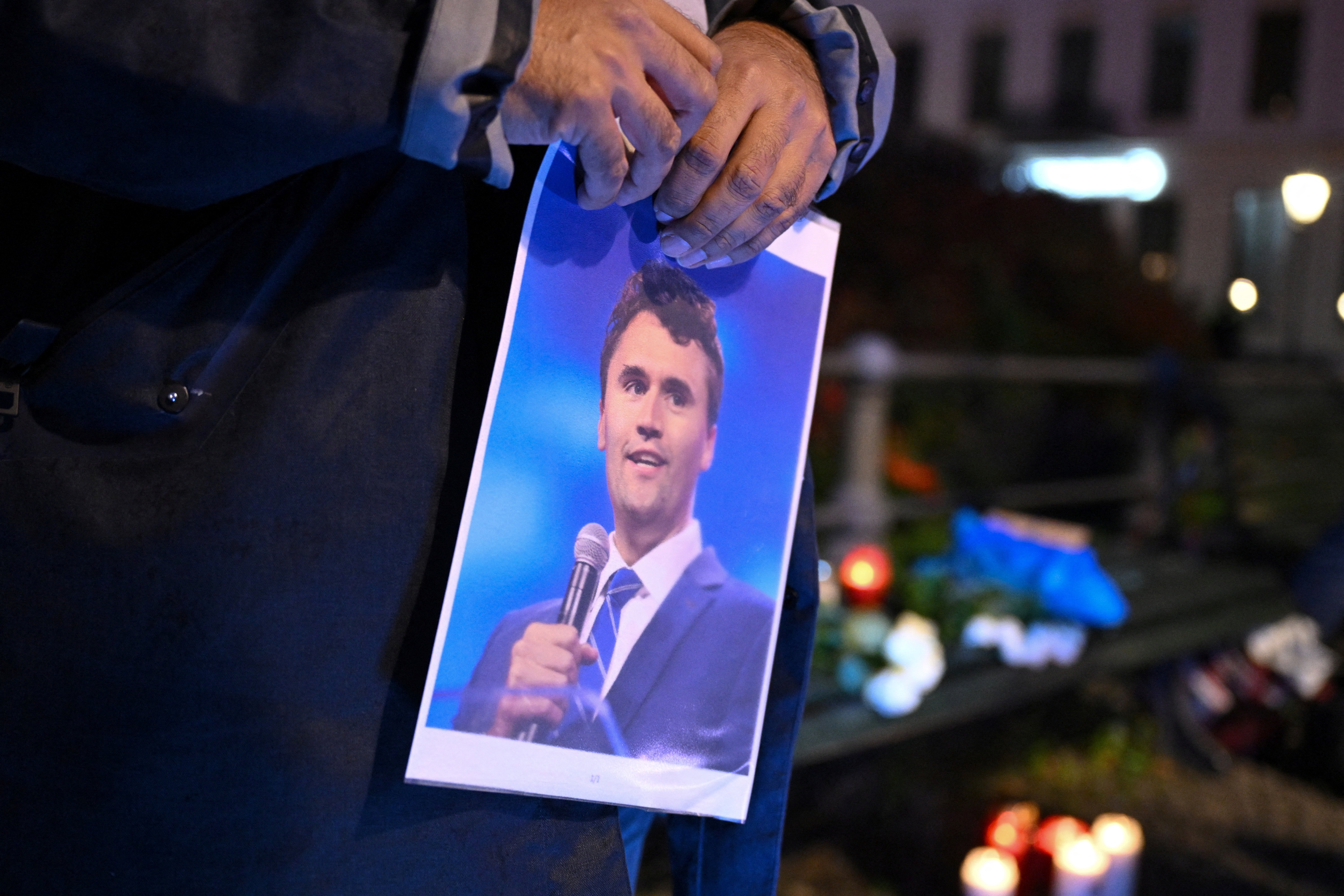 People gather to commemorate of Charlie Kirk in front of the Embassy of the United States in Berlin