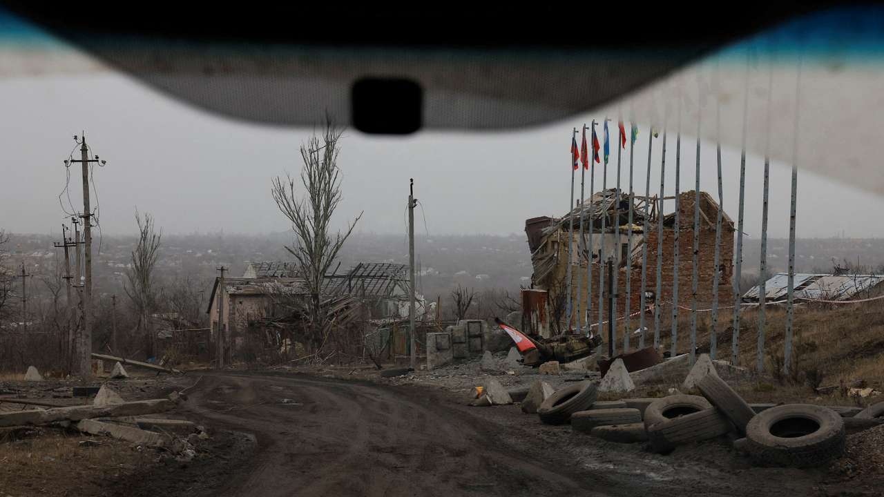 FILE PHOTO: A view from a car shows destroyed buildings in Avdiivka
