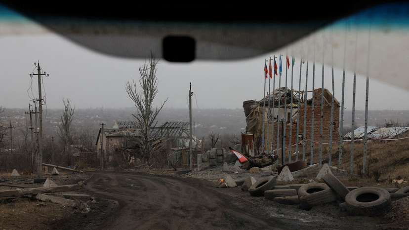 FILE PHOTO: A view from a car shows destroyed buildings in Avdiivka