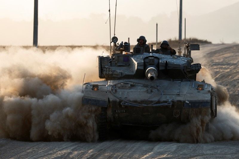 A tank manoeuvres near the Israel-Gaza border