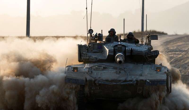 A tank manoeuvres near the Israel-Gaza border
