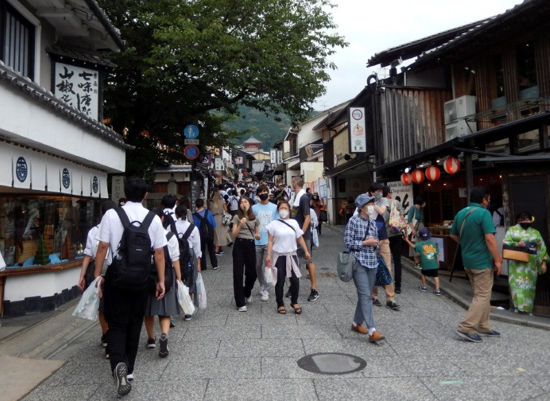 FILE PHOTO: People stroll near Kiyomizu-dera temple, a popular attraction among tourists, in Kyoto