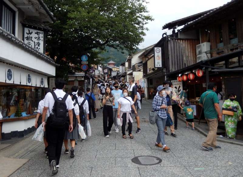 FILE PHOTO: People stroll near Kiyomizu-dera temple, a popular attraction among tourists, in Kyoto