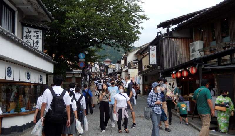 FILE PHOTO: People stroll near Kiyomizu-dera temple, a popular attraction among tourists, in Kyoto