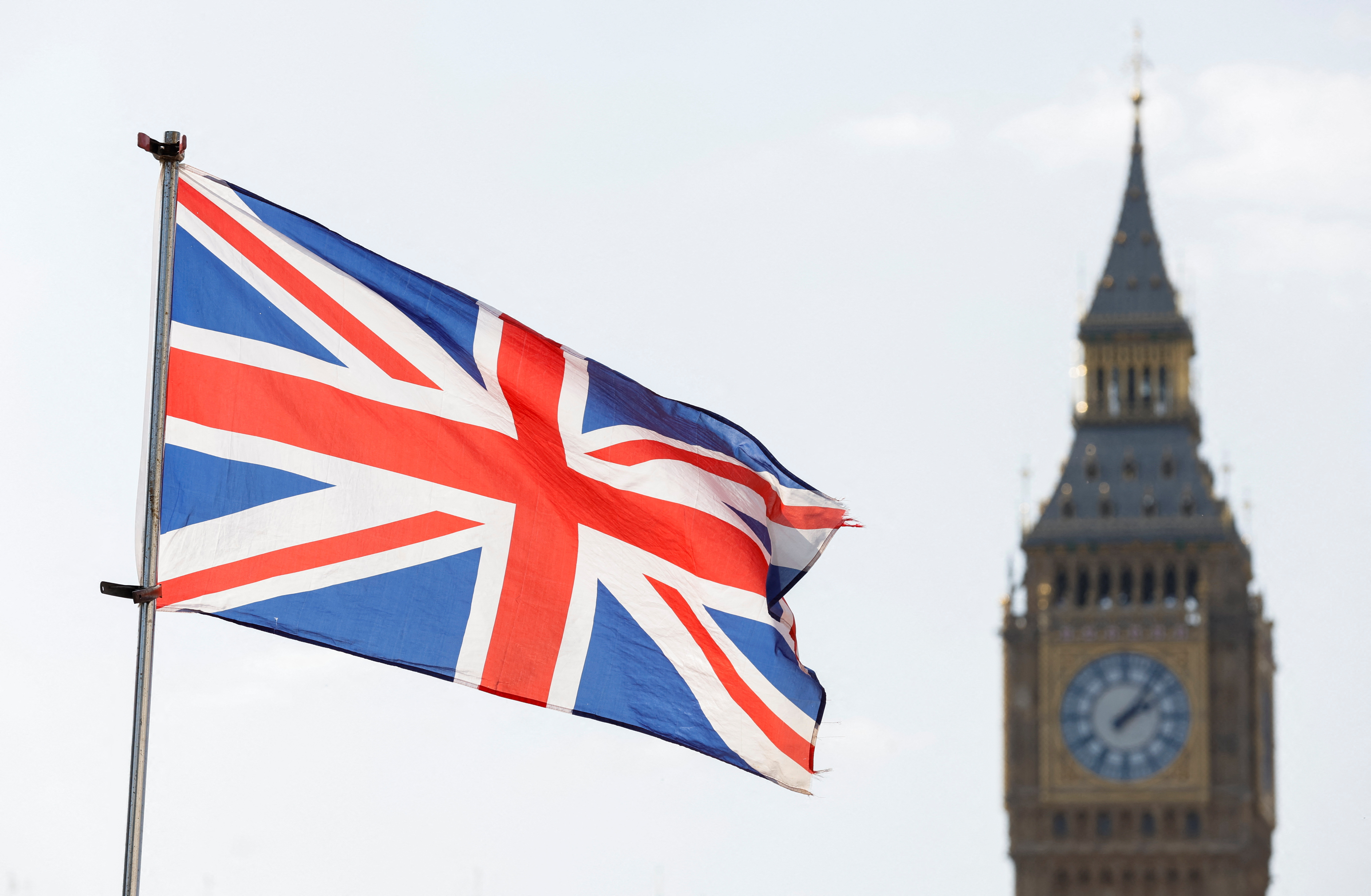 FILE PHOTO: The Britain's national flag flies next to the Elizabeth Tower, commonly known as Big Ben, in London