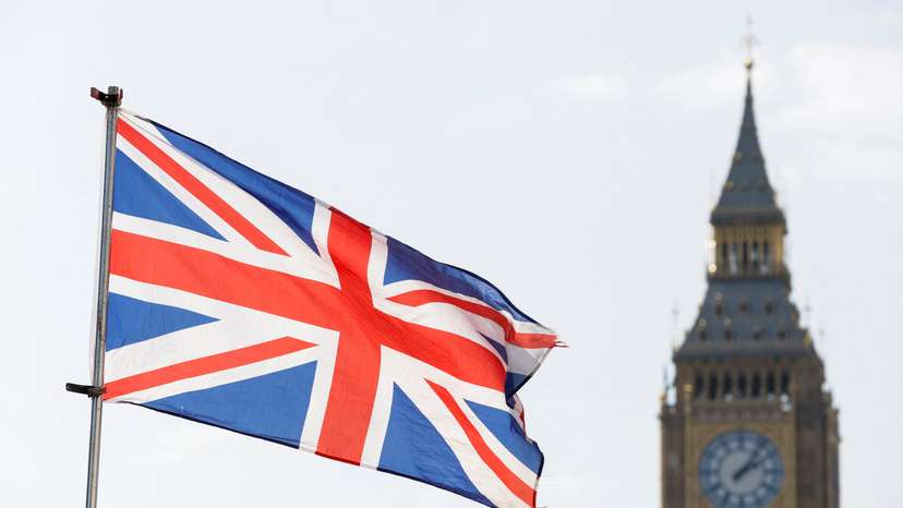 FILE PHOTO: The Britain's national flag flies next to the Elizabeth Tower, commonly known as Big Ben, in London