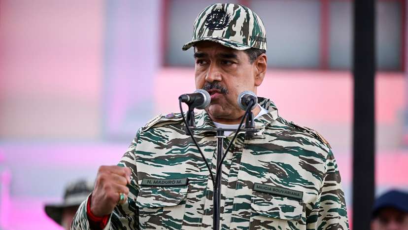 Members of the Bolivarian Militia and supporters of President Nicolas Maduro march to plead allegiance