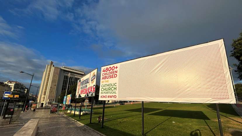 Billboard denounces child sexual abuse by Portuguese Catholic clergy during the XXXVII World Youth Day celebration in Lisbon