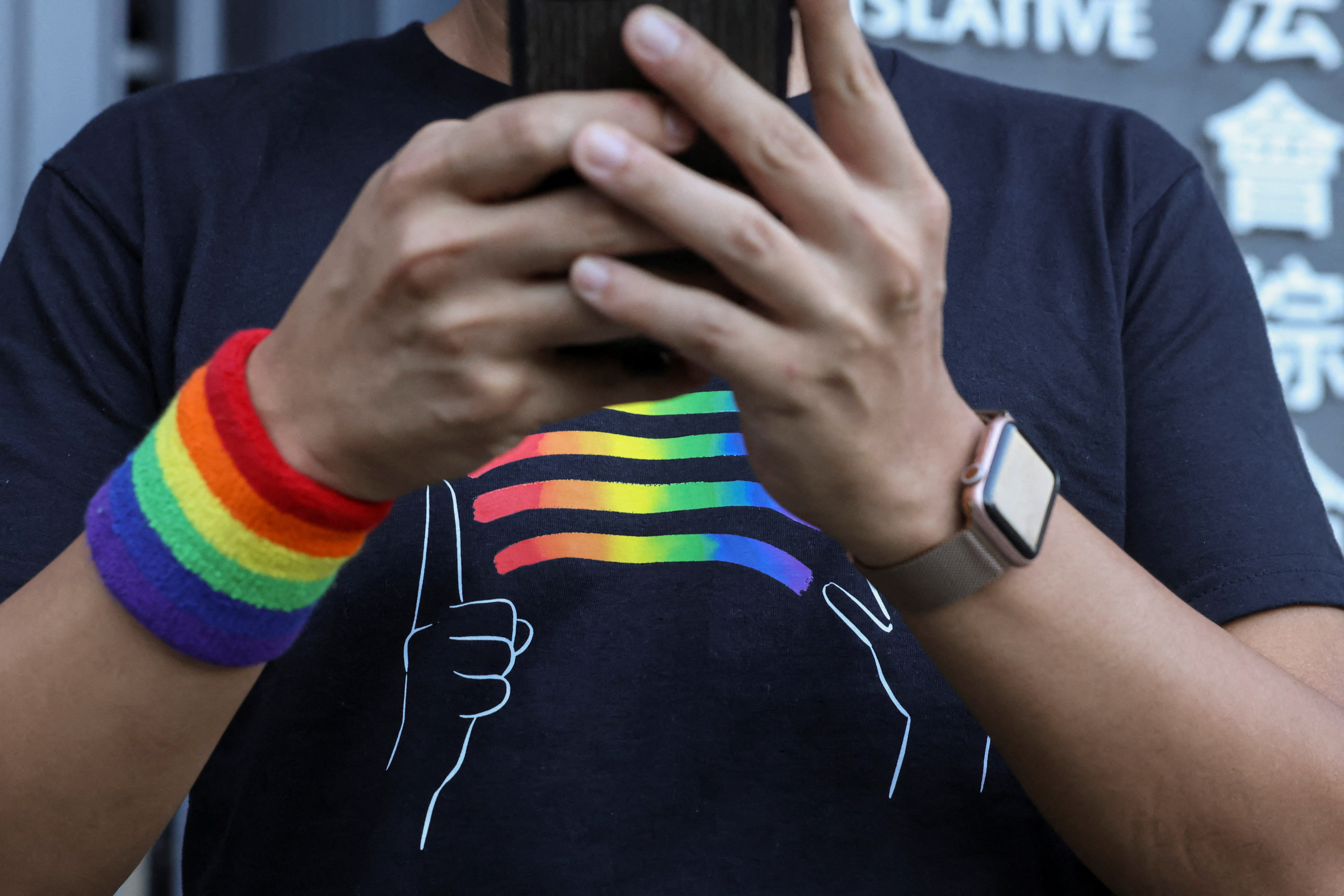 LGBTQ activist Jimmy Sham speaks to media outside the Legislative Council Building after lawmakers vote on the registration of same-sex partnerships bill, which allows couples registered abroad to register locally, in Hong Kong