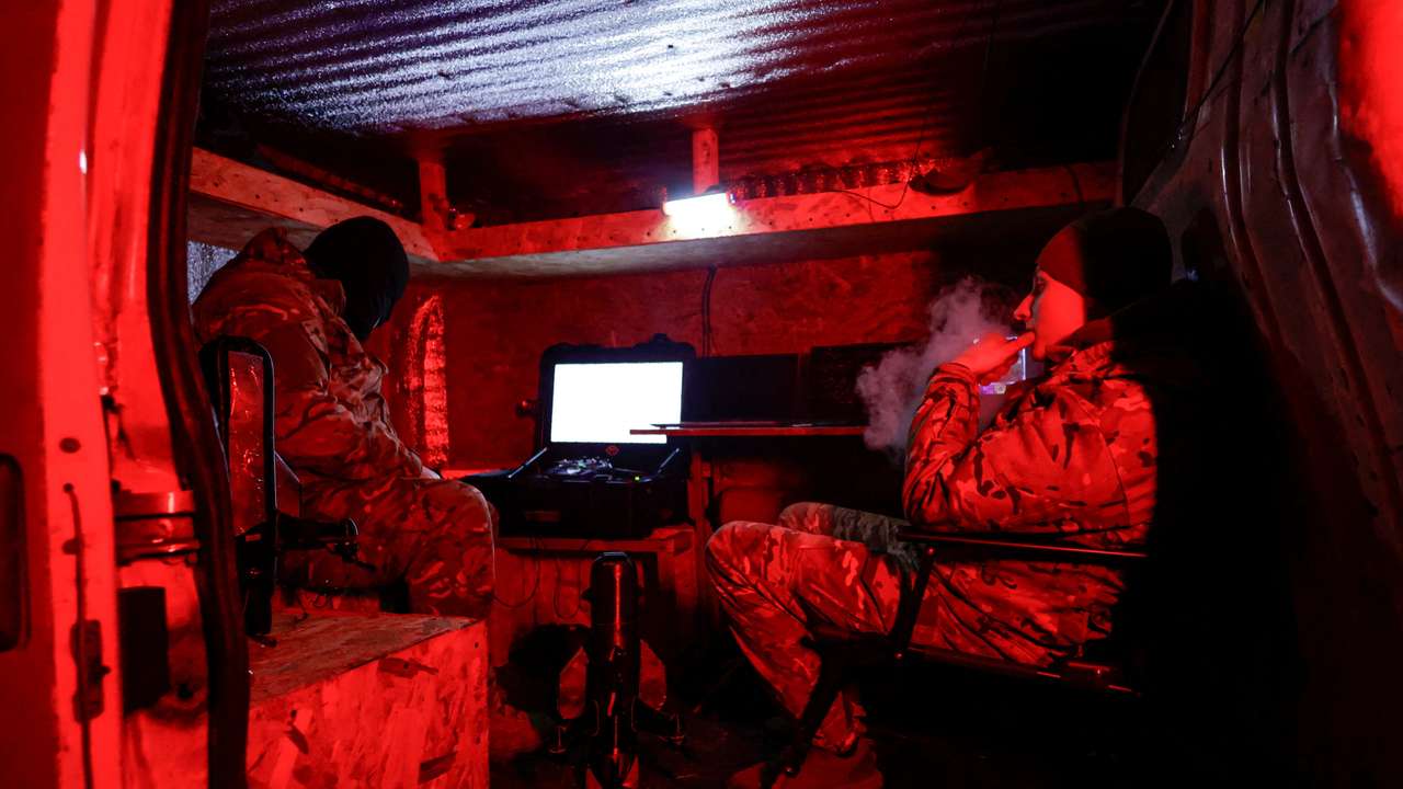 Ukrainian servicemen of an air defence unit wait inside a van during their combat shift near the frontline town of Kupiansk