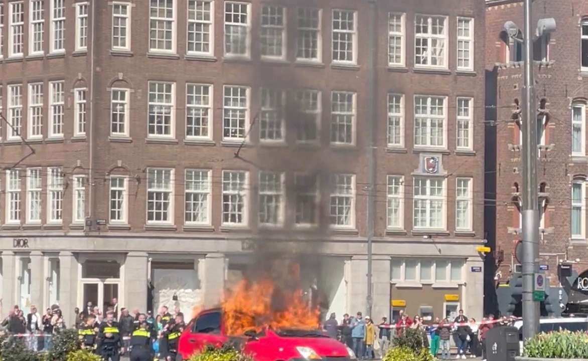Car burns in a square in Amsterdam