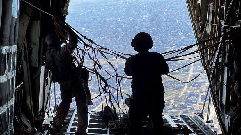 U.S. military personnel air drop aid parcels over Gaza