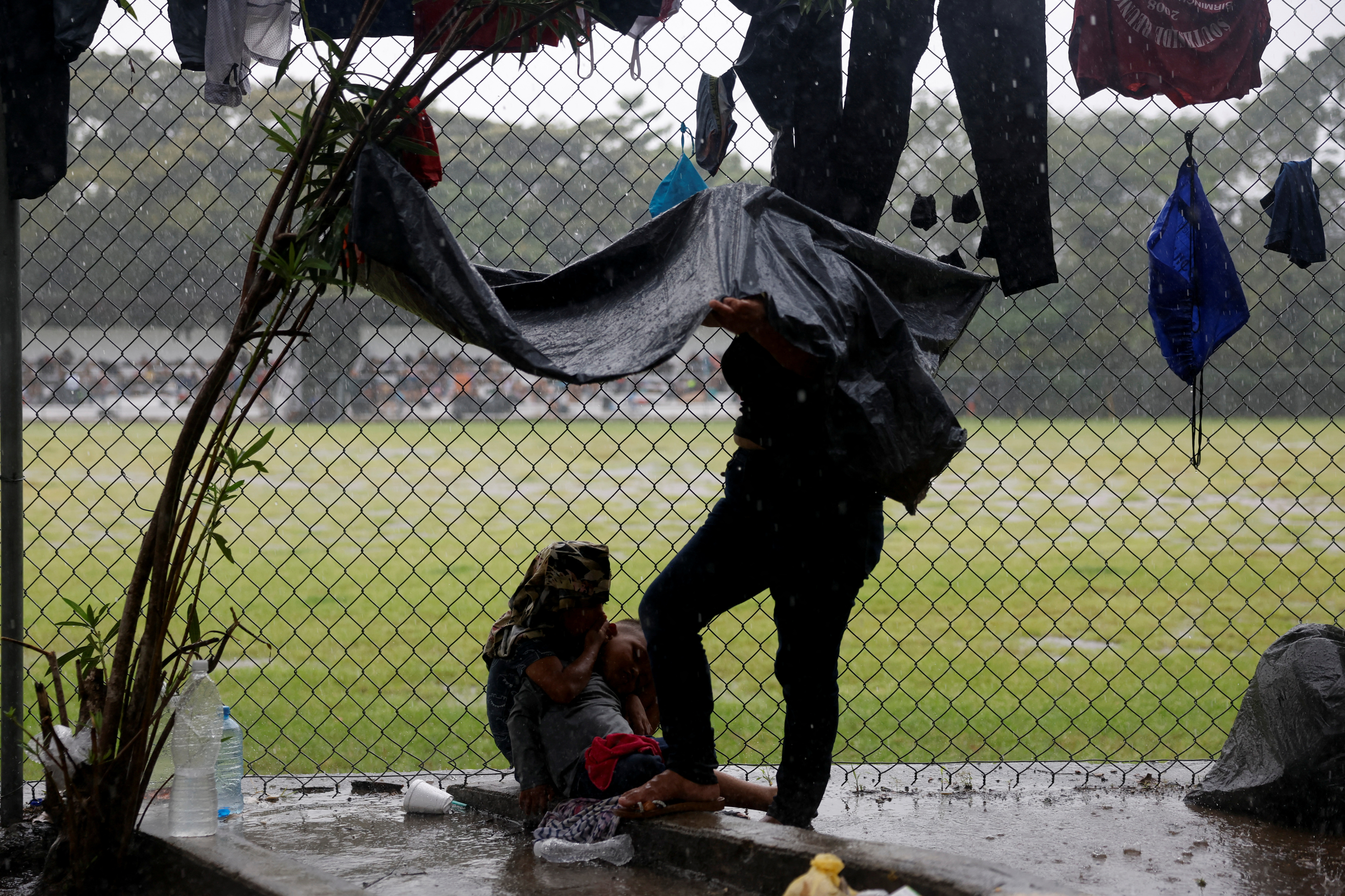 Migrant caravan stops to rest before moving on its way to the U.S.-Mexico border, in Escuintla