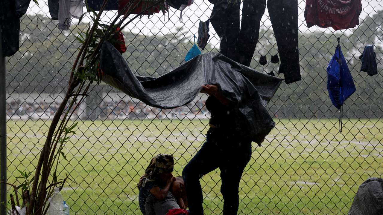 Migrant caravan stops to rest before moving on its way to the U.S.-Mexico border, in Escuintla