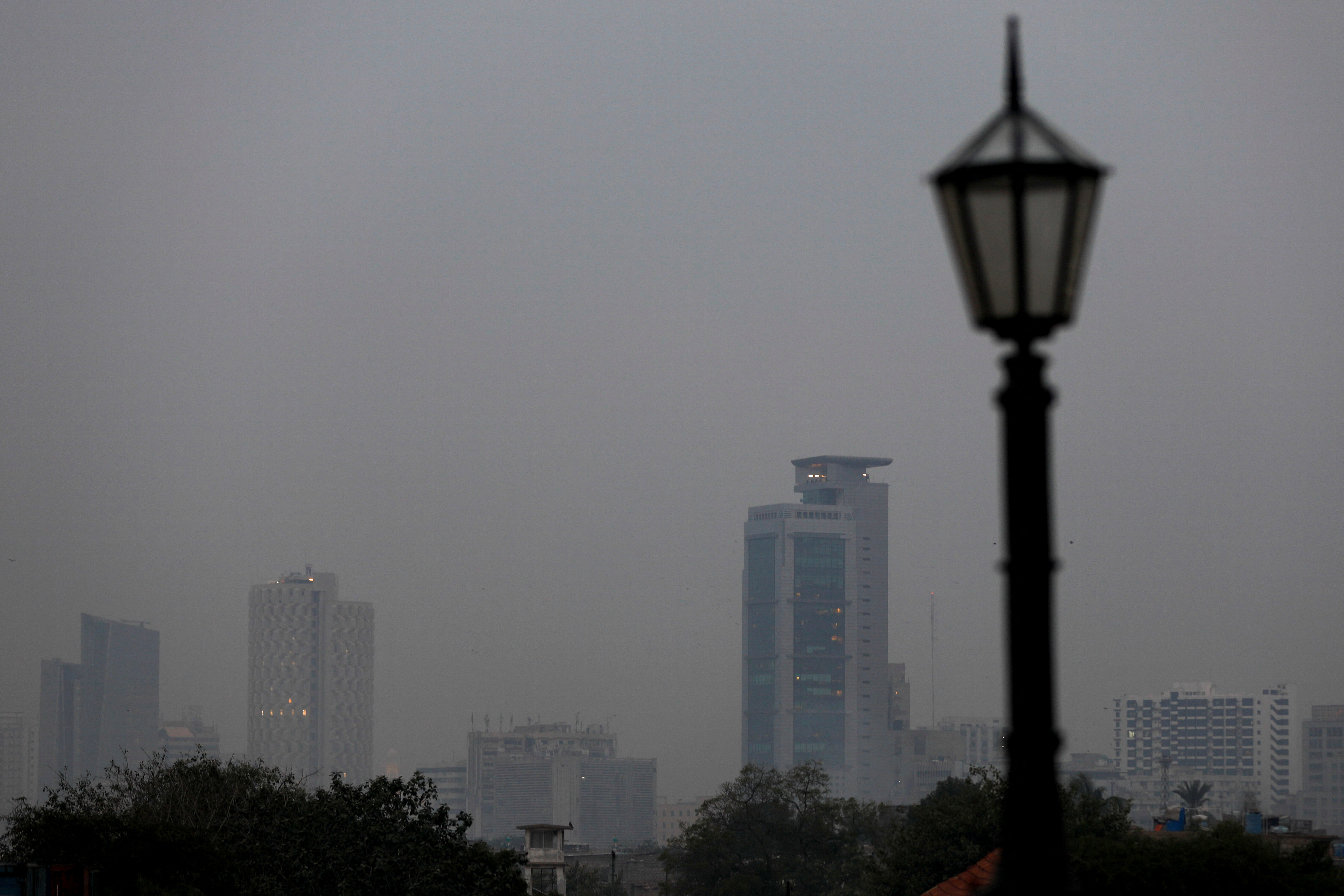 A general view of commercial banks amid haze during evening hours in Karachi
