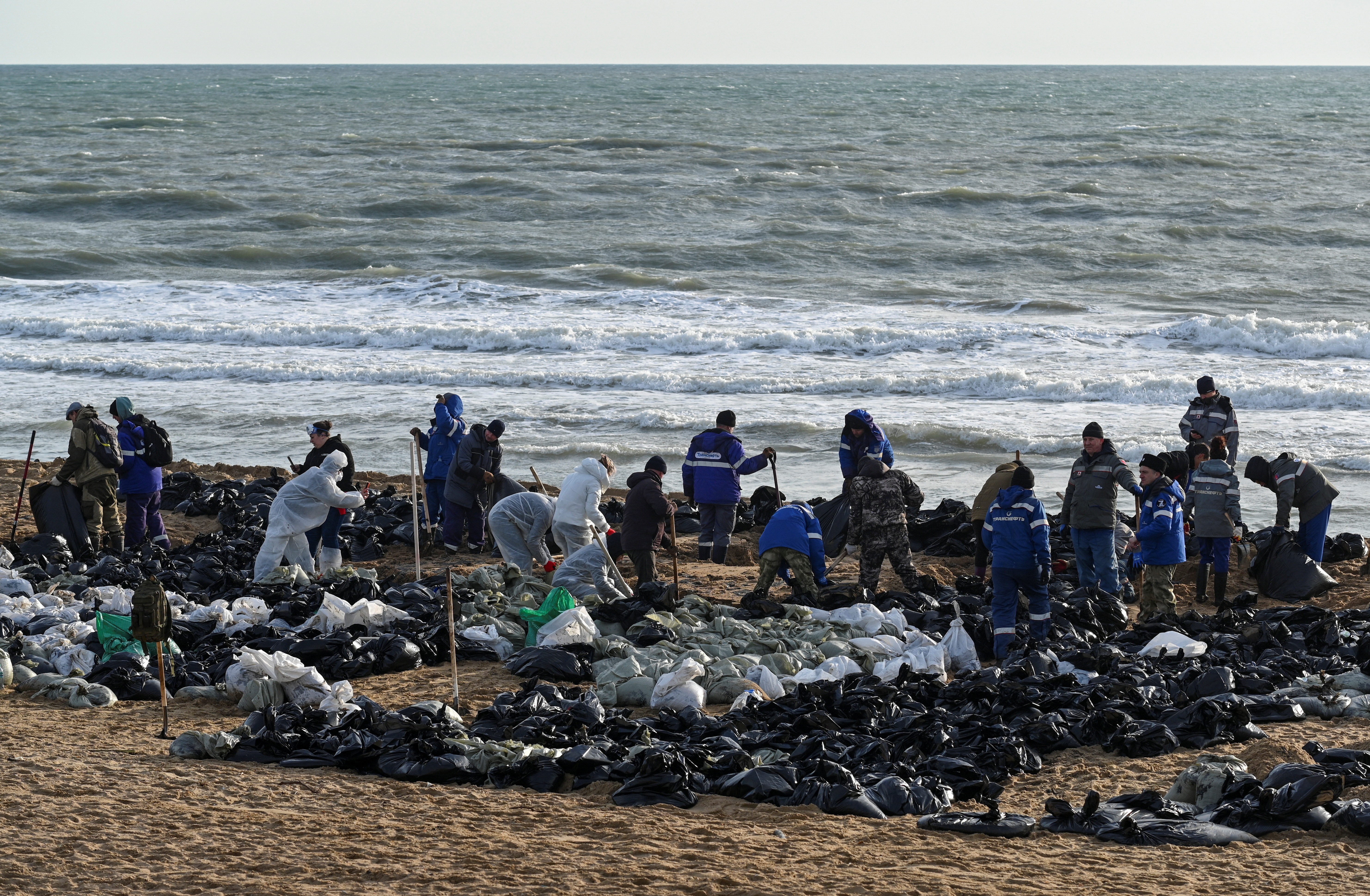 Volunteers battle to clear spilled oil on Russia's Black Sea coast