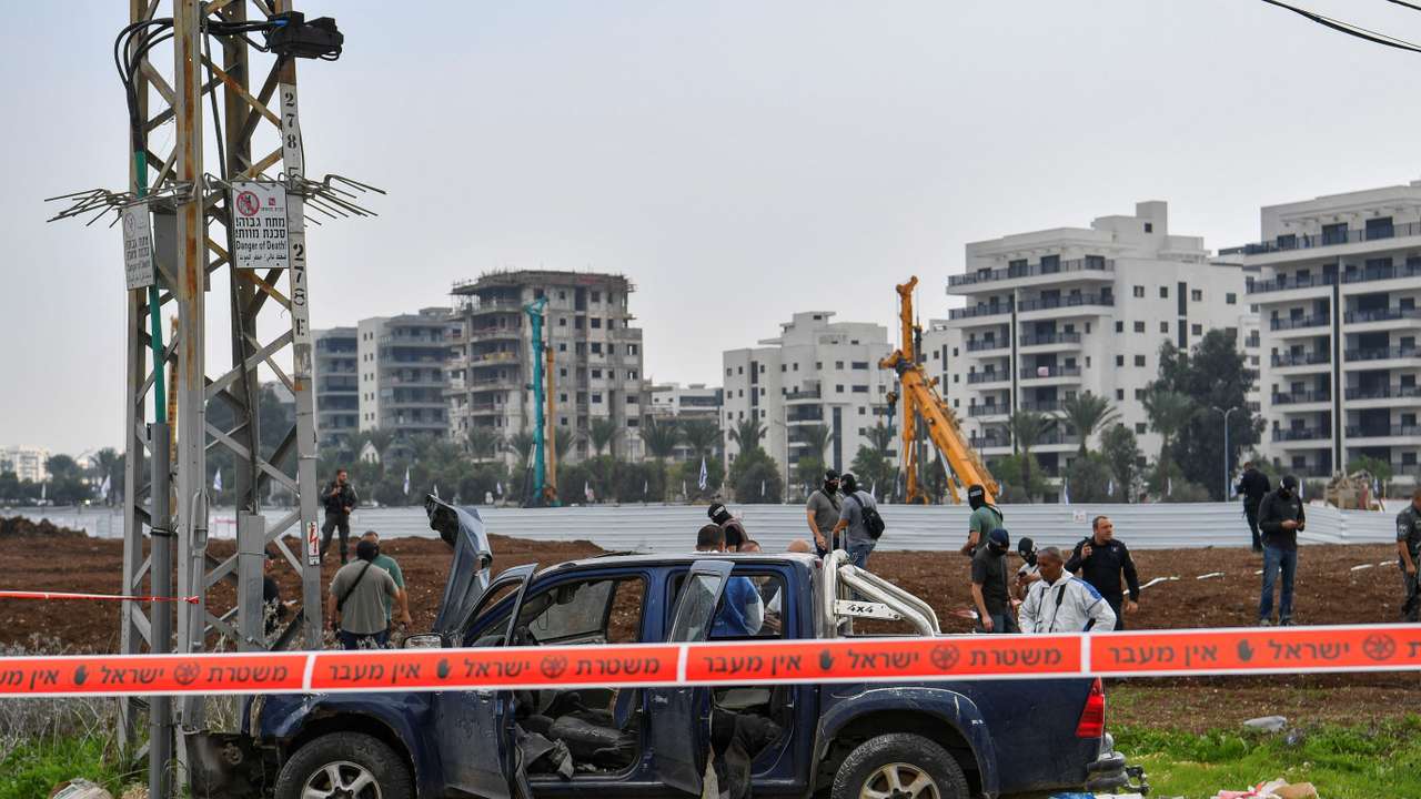 Israeli security forces inspect the scene where a vehicle was used by assailant in a suspected ramming and stabbing attack that killed two people in northern Israel according to Israeli authorities, in Afula