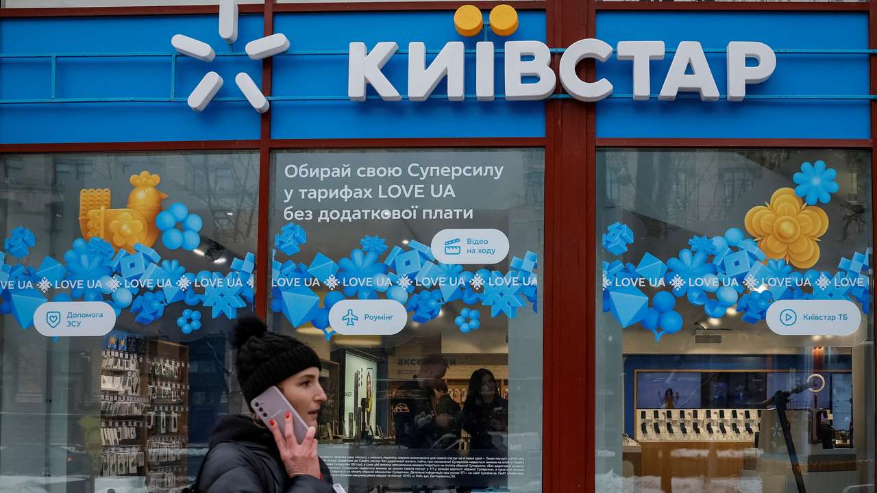 FILE PHOTO: Woman walks past a Kyivstar store in Kyiv