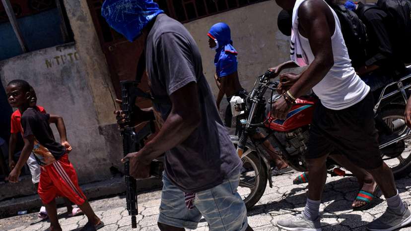 FILE PHOTO: The Wider Image: Camping in schools, hungry Haiti families ask: when will normality return?