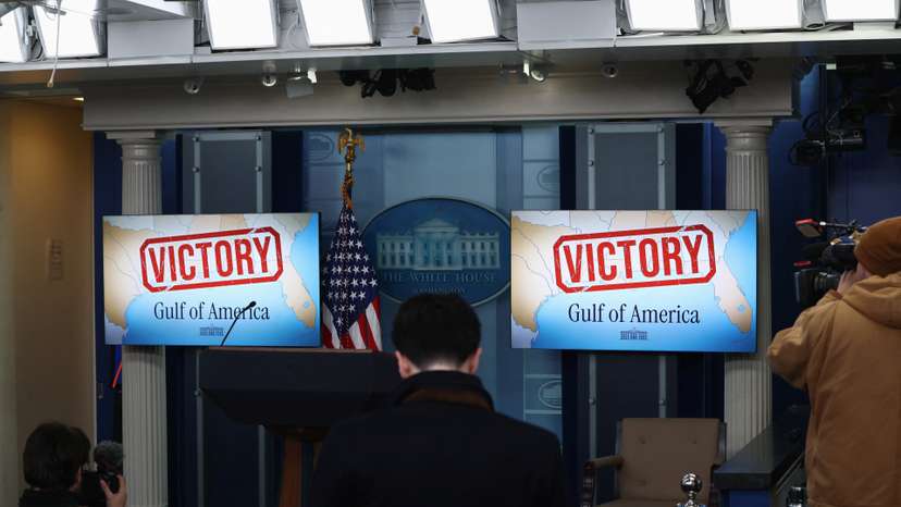 TV screens in the White House briefing room display the words "Victory" in Washington