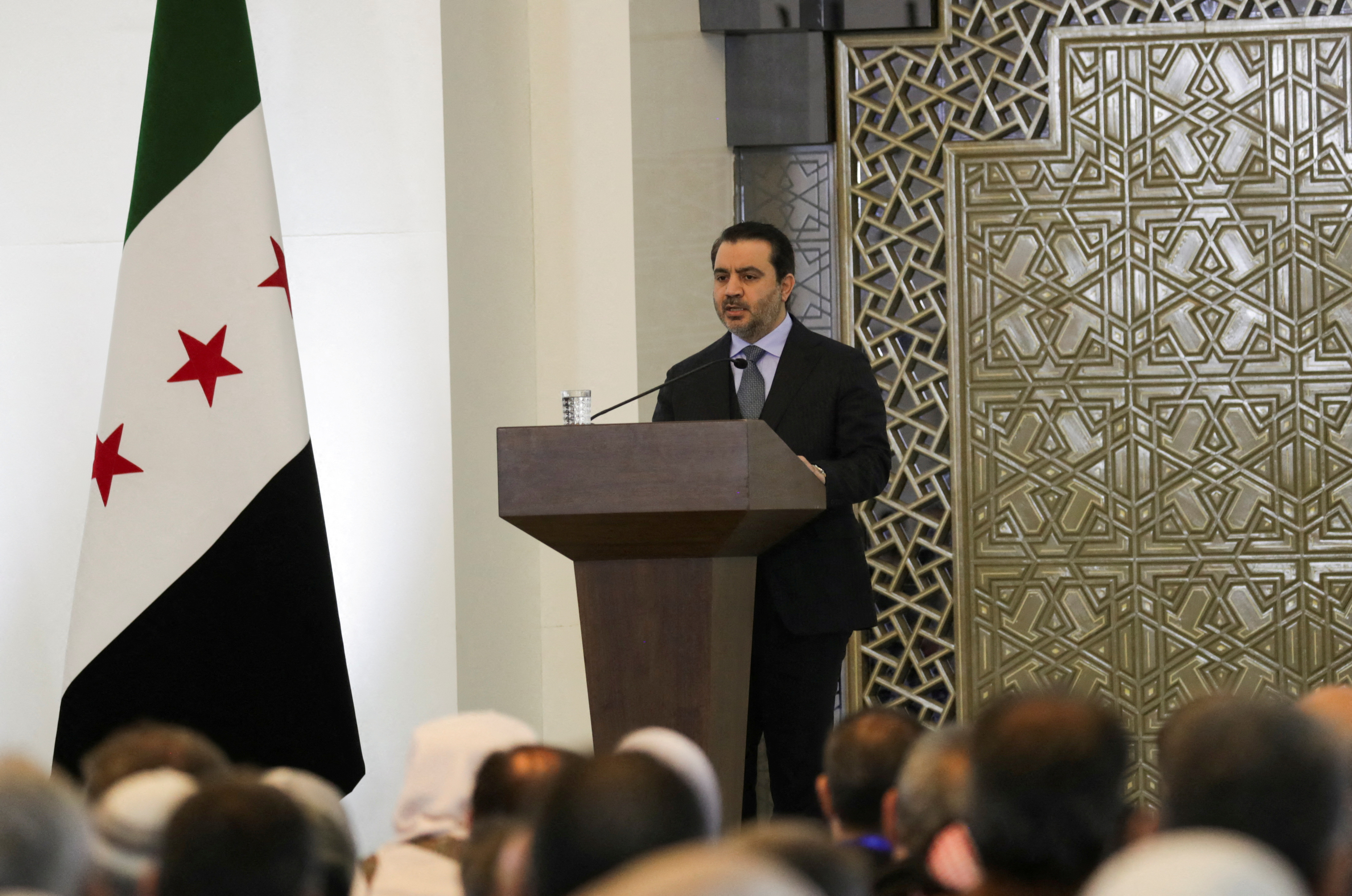 FILE PHOTO: Syrian Foreign Minister Asaad Hassan al-Shibani speaks during a national dialogue, in Damascus