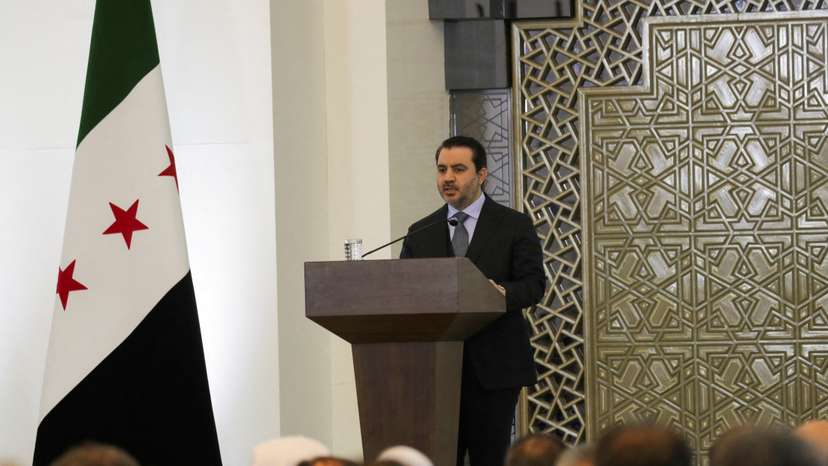FILE PHOTO: Syrian Foreign Minister Asaad Hassan al-Shibani speaks during a national dialogue, in Damascus