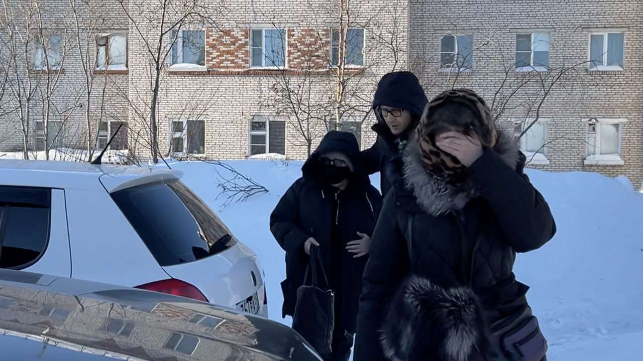 A woman, believed to be the mother of Alexei Navalny, leaves the penal colony in Kharp