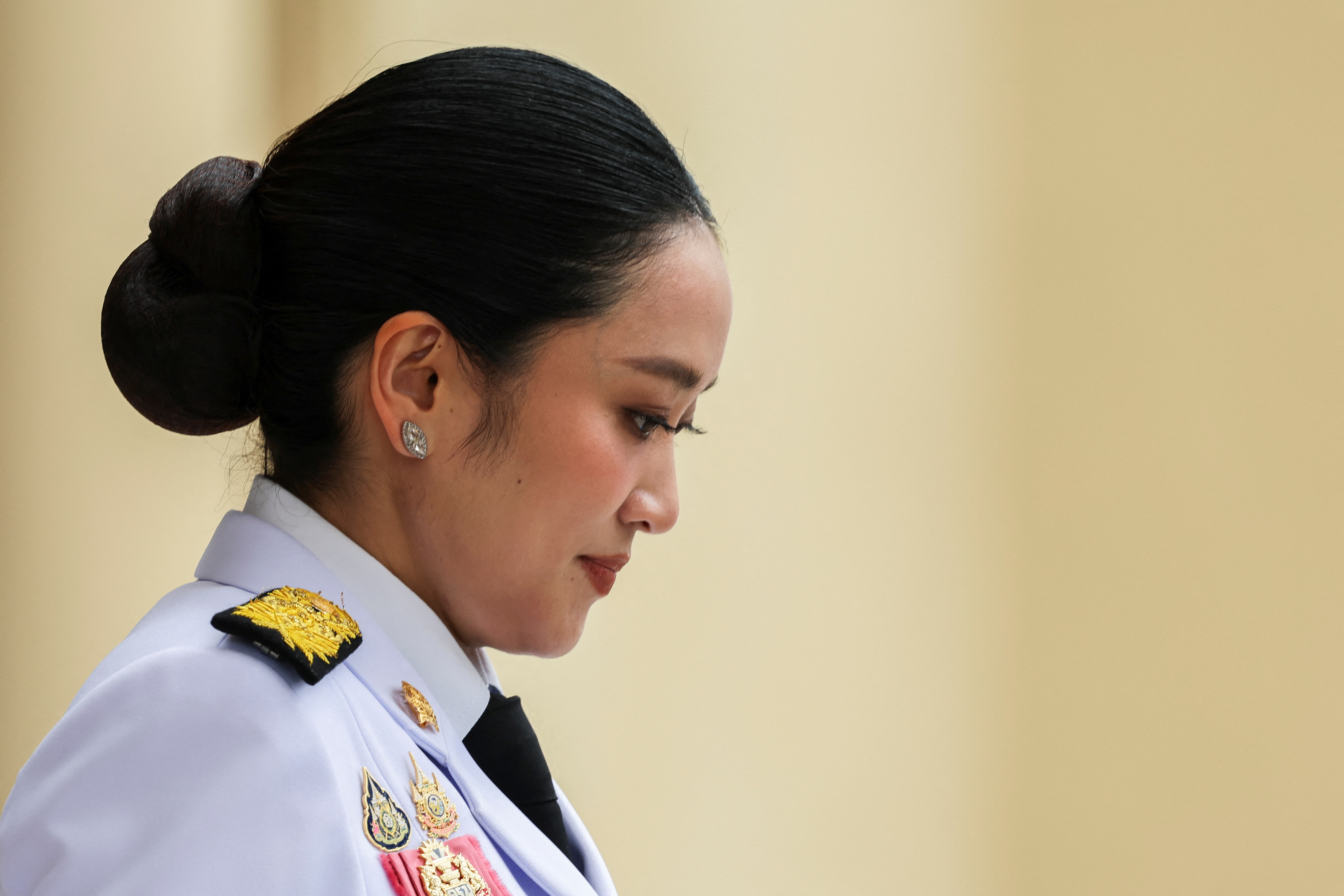 Thailand’s Prime Minister Paetongtarn Shinawatra reacts as she leaves for a royal oath-taking ceremony for the new cabinet, in Bangkok