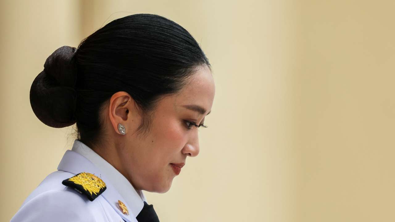 Thailand’s Prime Minister Paetongtarn Shinawatra reacts as she leaves for a royal oath-taking ceremony for the new cabinet, in Bangkok