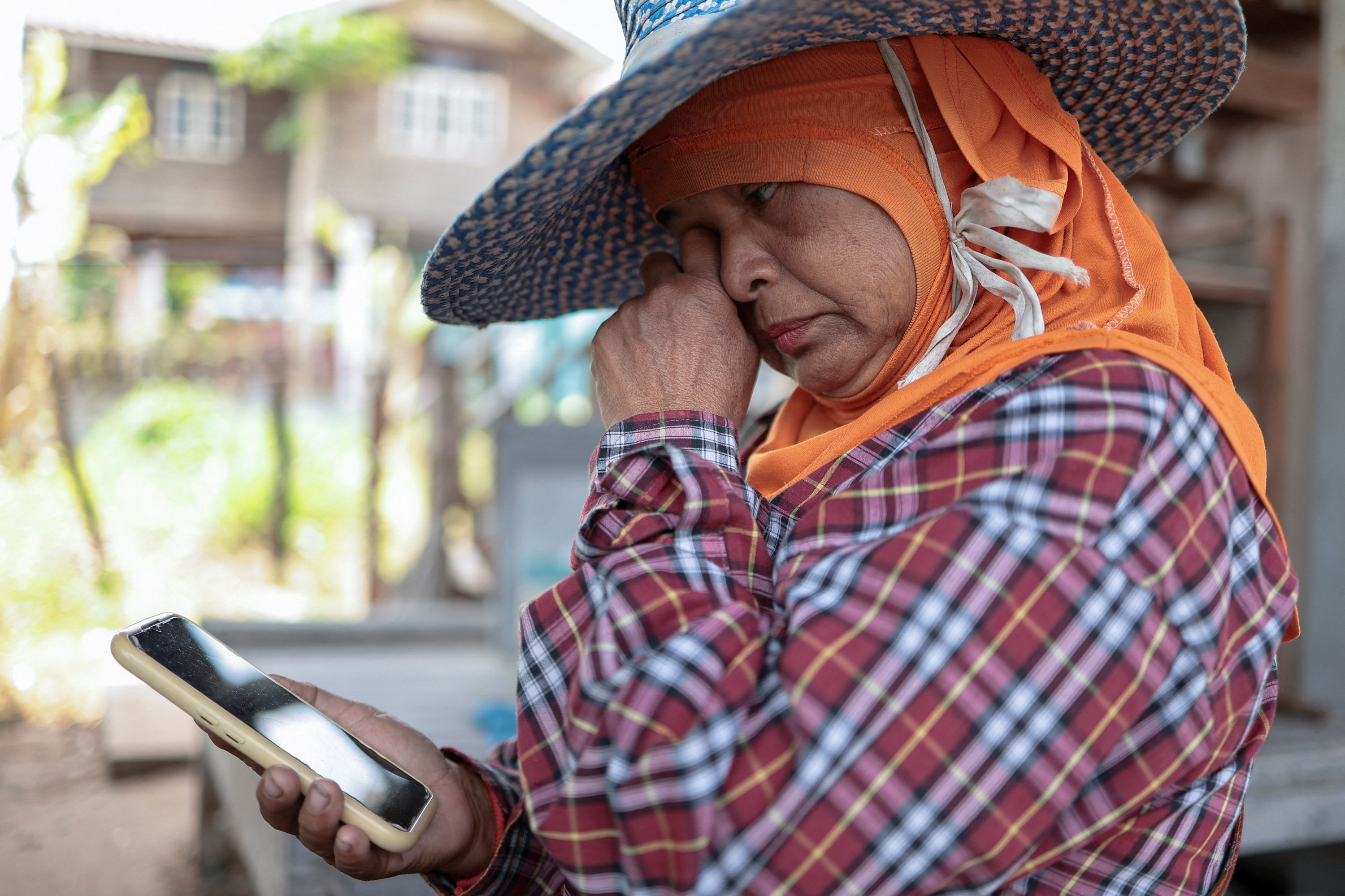 Thai aunt awaits news of a missing Thai crew member after Strait of Hormuz attack, in Surin province