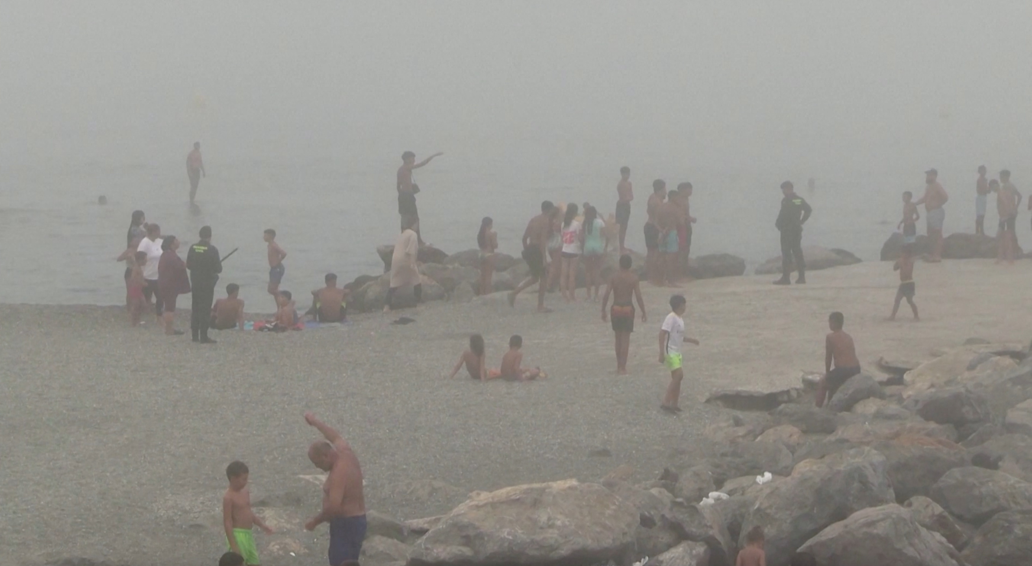 Migrants swim to El Tarajal beach