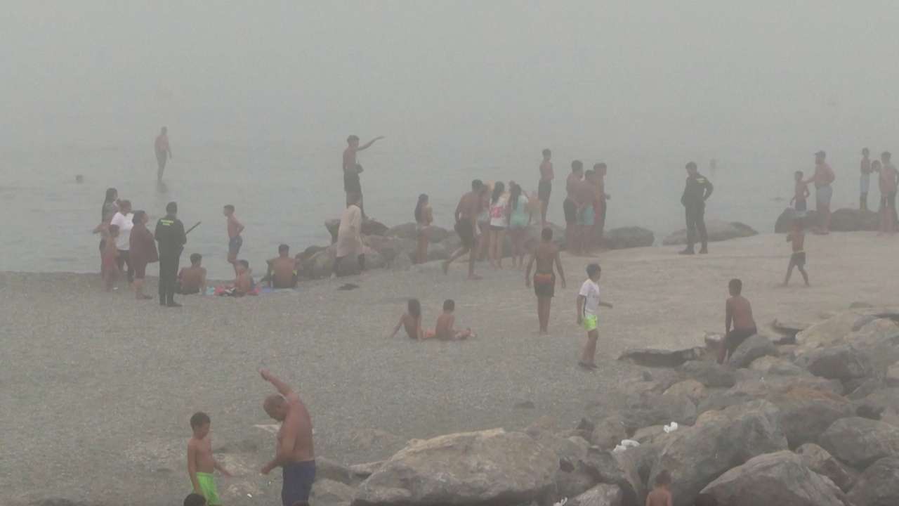 Migrants swim to El Tarajal beach