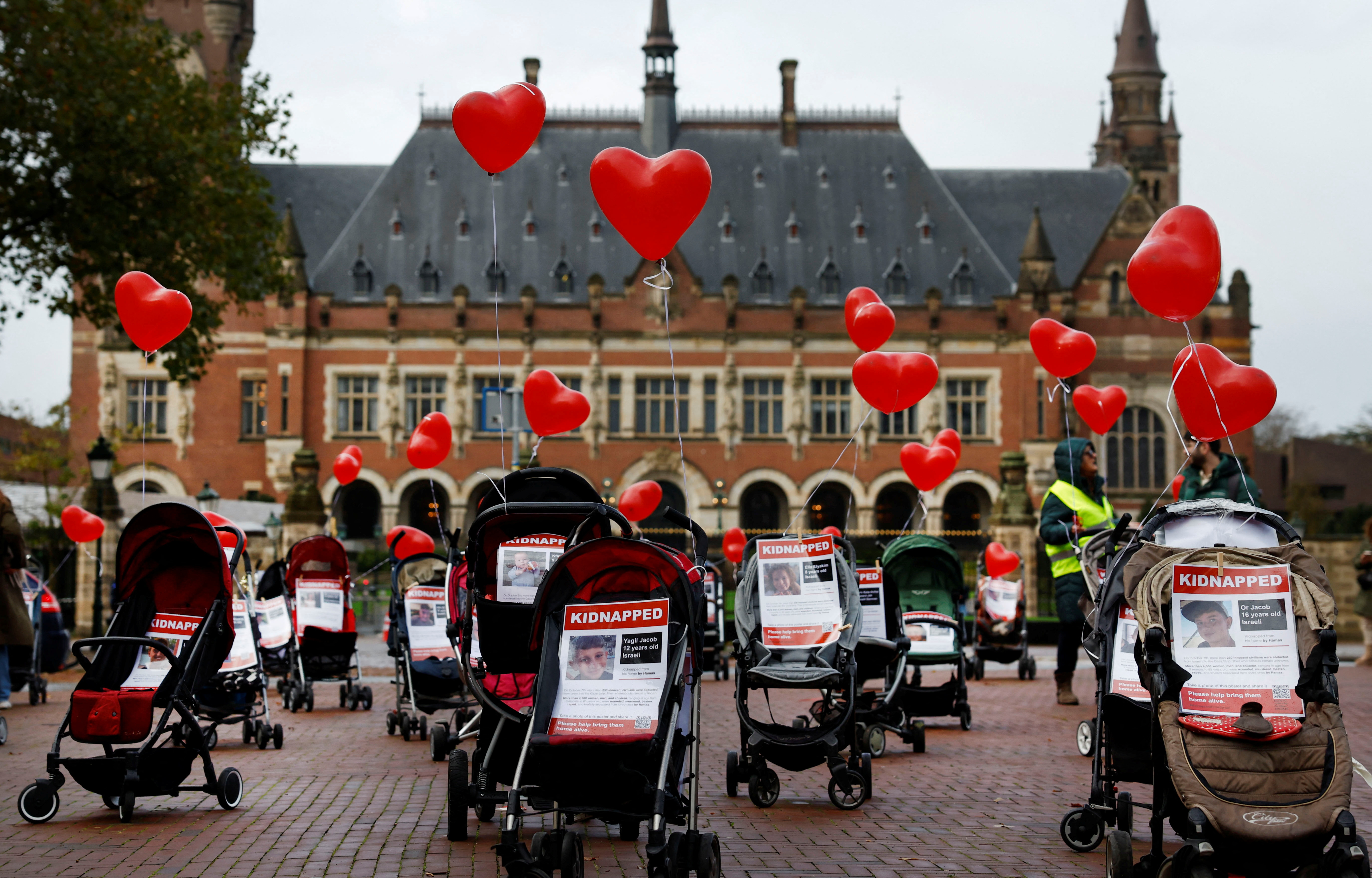 FILE PHOTO: Strollers with pictures of kidnapped children are placed by protesters in front of the seat of the United Nations World Court in The Hague
