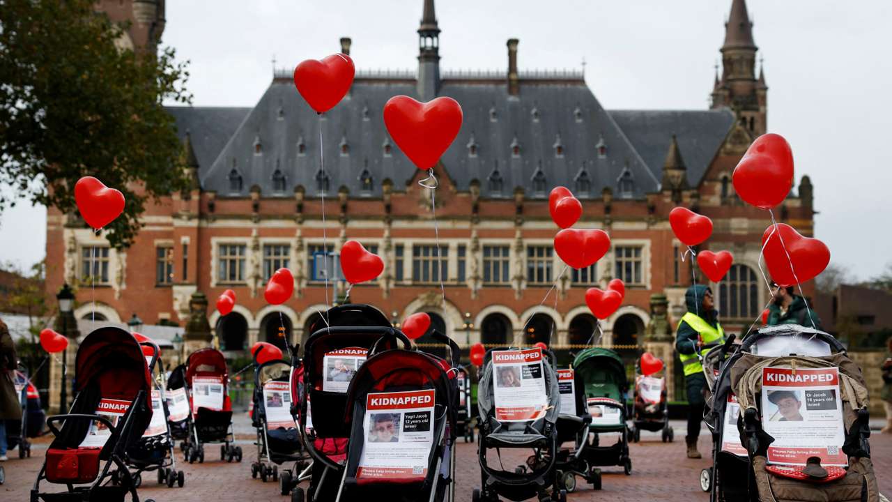 FILE PHOTO: Strollers with pictures of kidnapped children are placed by protesters in front of the seat of the United Nations World Court in The Hague