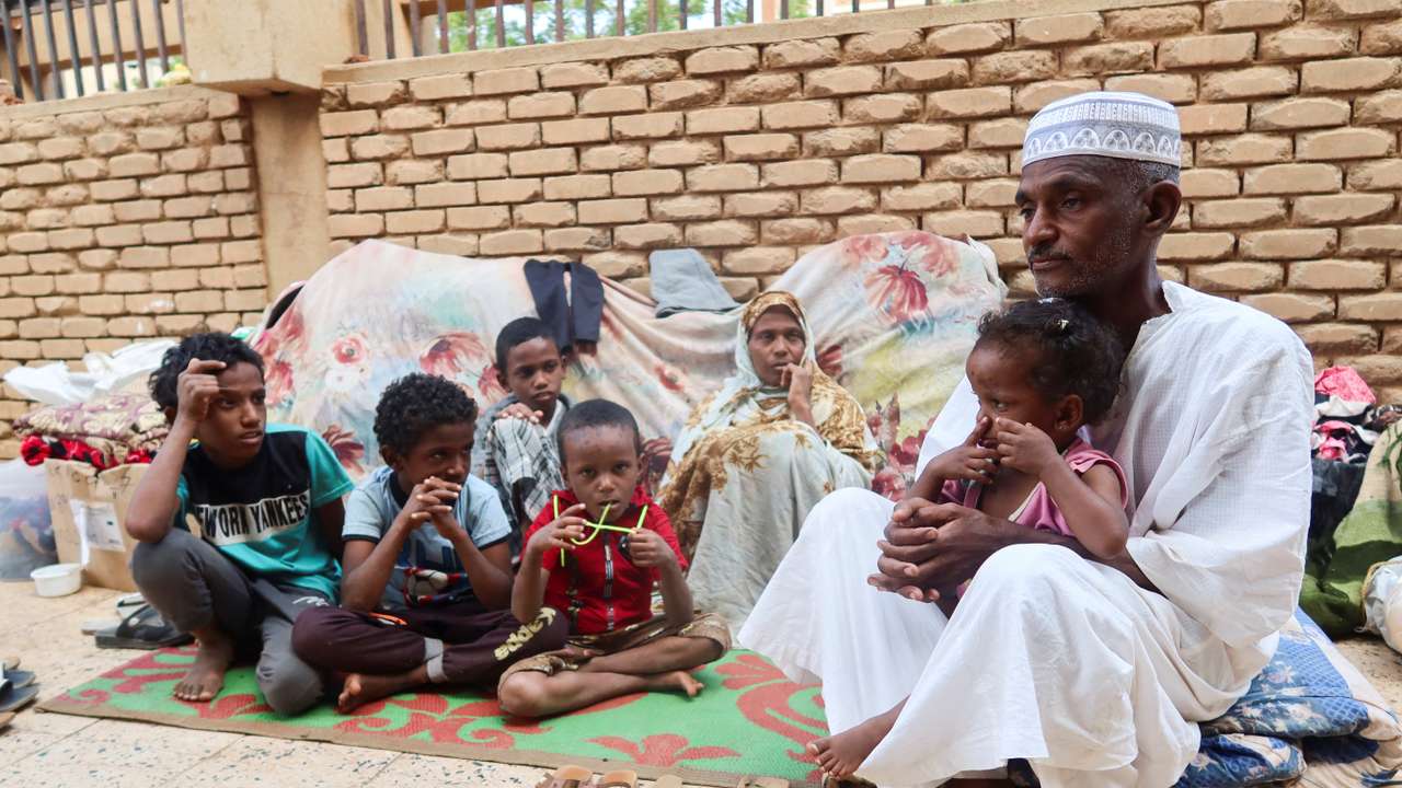Muhammad Awad and his family rest after leaving Tuti Island, which is controlled by Rapid Support Forces (RSF), in Omdurman
