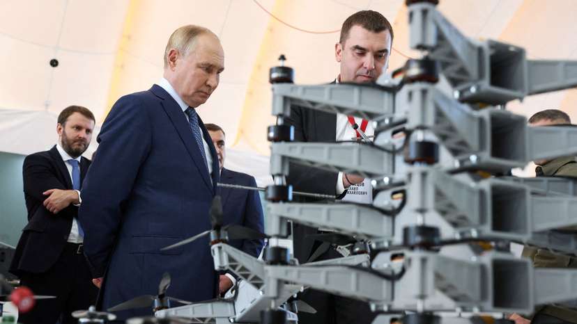 FILE PHOTO: Russia's President Vladimir Putin visits a drone production facility in Saint Petersburg