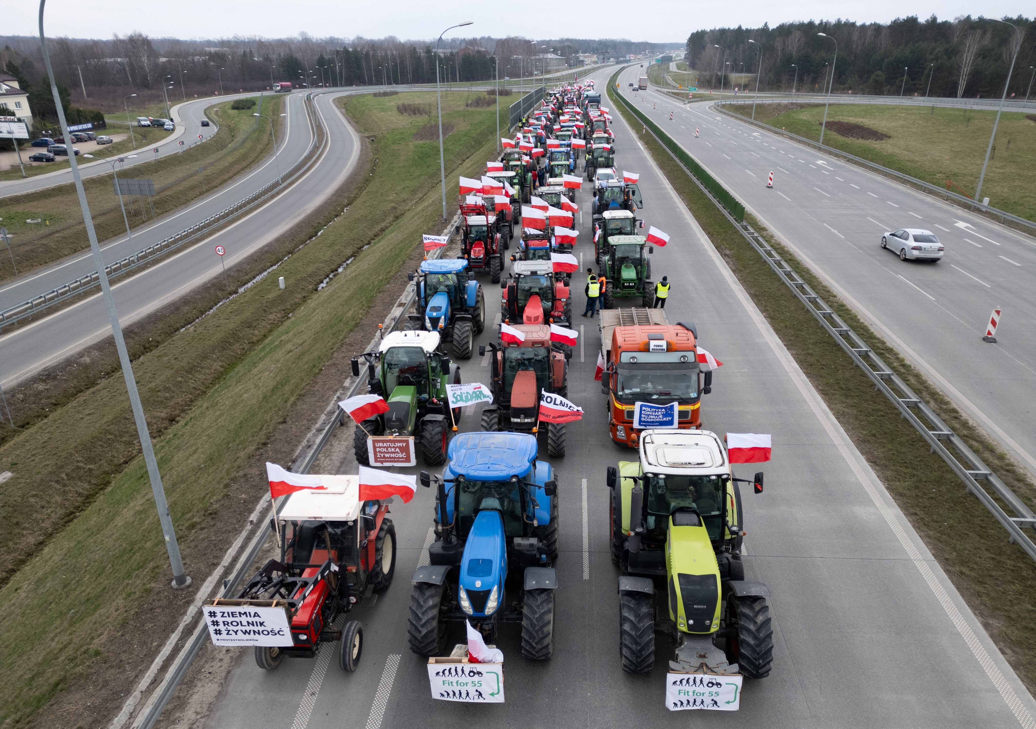 A drone view of farmer's tractors blocking a speedway from Lublin to Warsaw, on the outskirts of Warsaw in Wiazowna