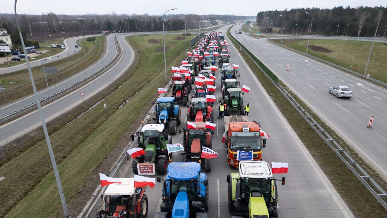 A drone view of farmer's tractors blocking a speedway from Lublin to Warsaw, on the outskirts of Warsaw in Wiazowna