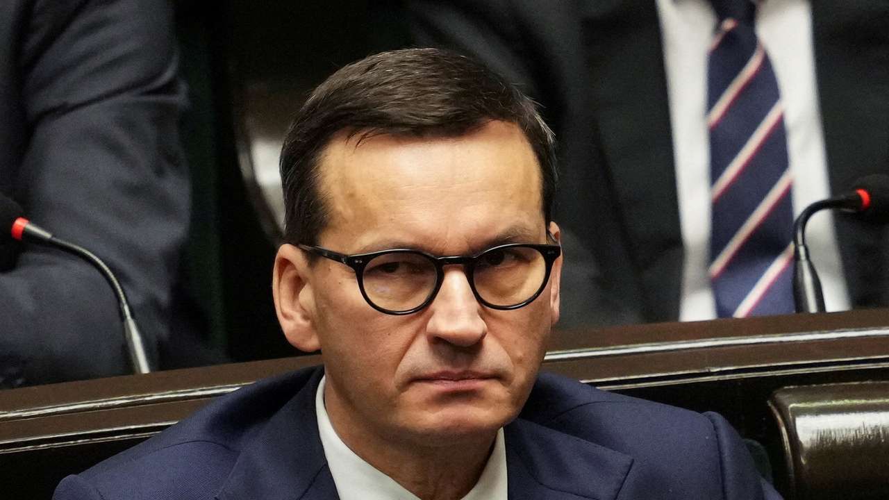 FILE PHOTO: Former Polish PM Morawiecki attends new government's programme presentation in Warsaw