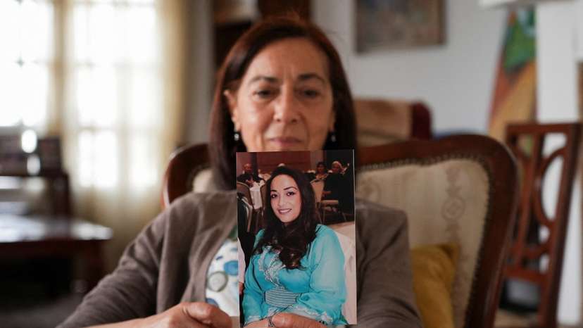 Tunisian activist Cherifa Riahi's mother Farida holds a picture of her daughter, Cherifa, at her house in Tunis