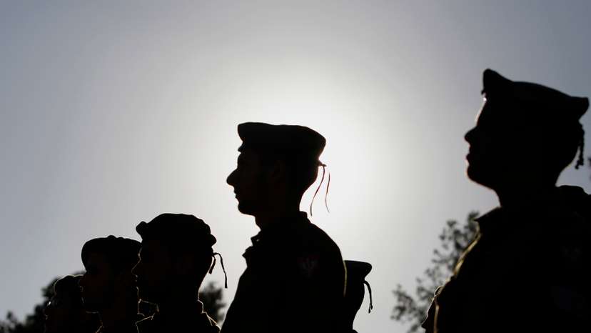 Israeli soldiers of the Netzah Yehuda Haredi infantry battalion stand at attention during their swearing-in ceremony in Jerusalem