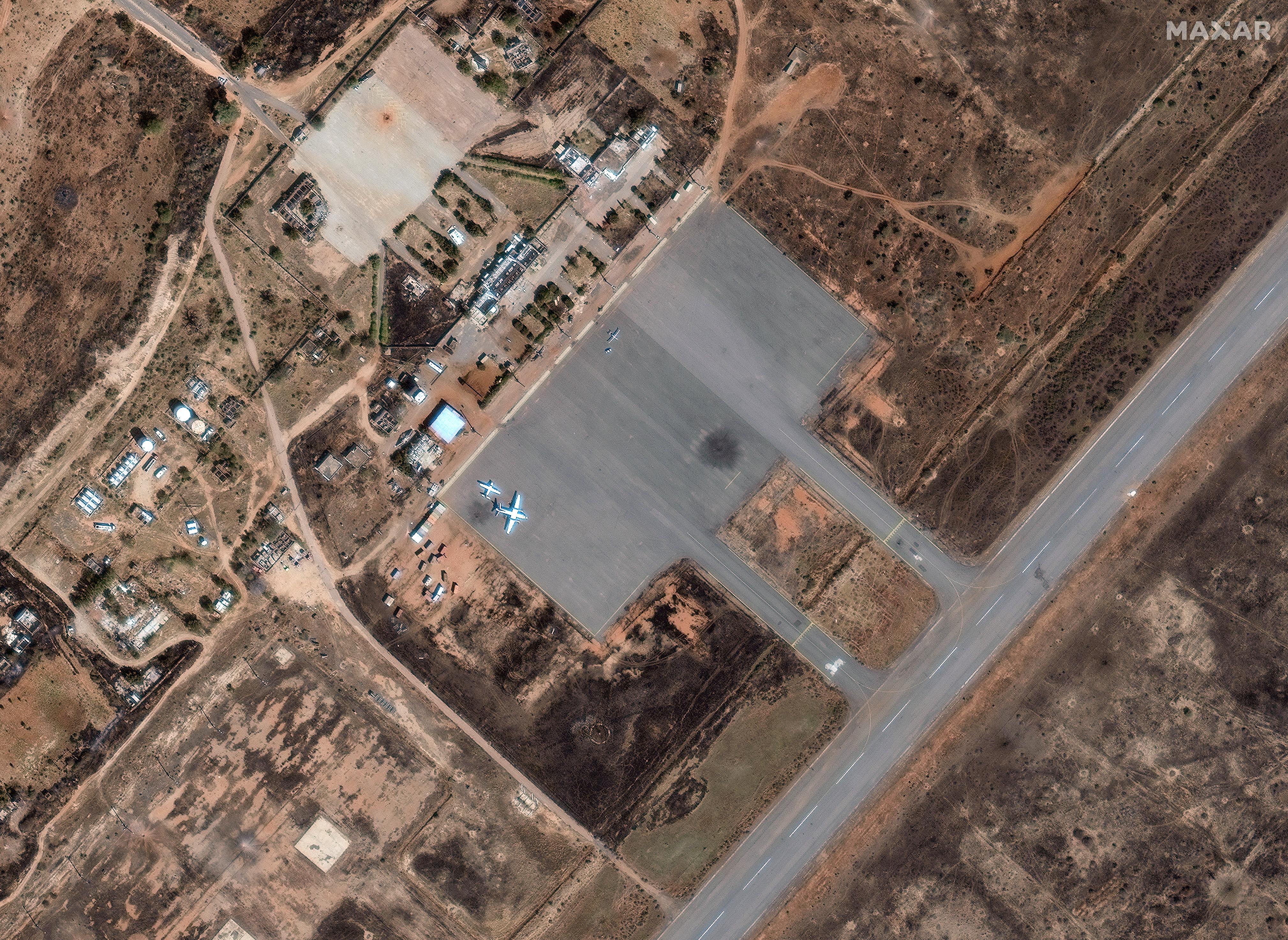 A satellite image shows two UAVs and a newly constructed hangar near the airstrip at the Nyala airport